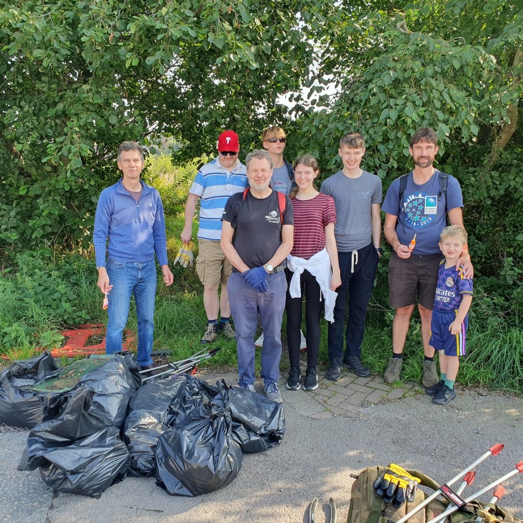Volunteers with bags of litter