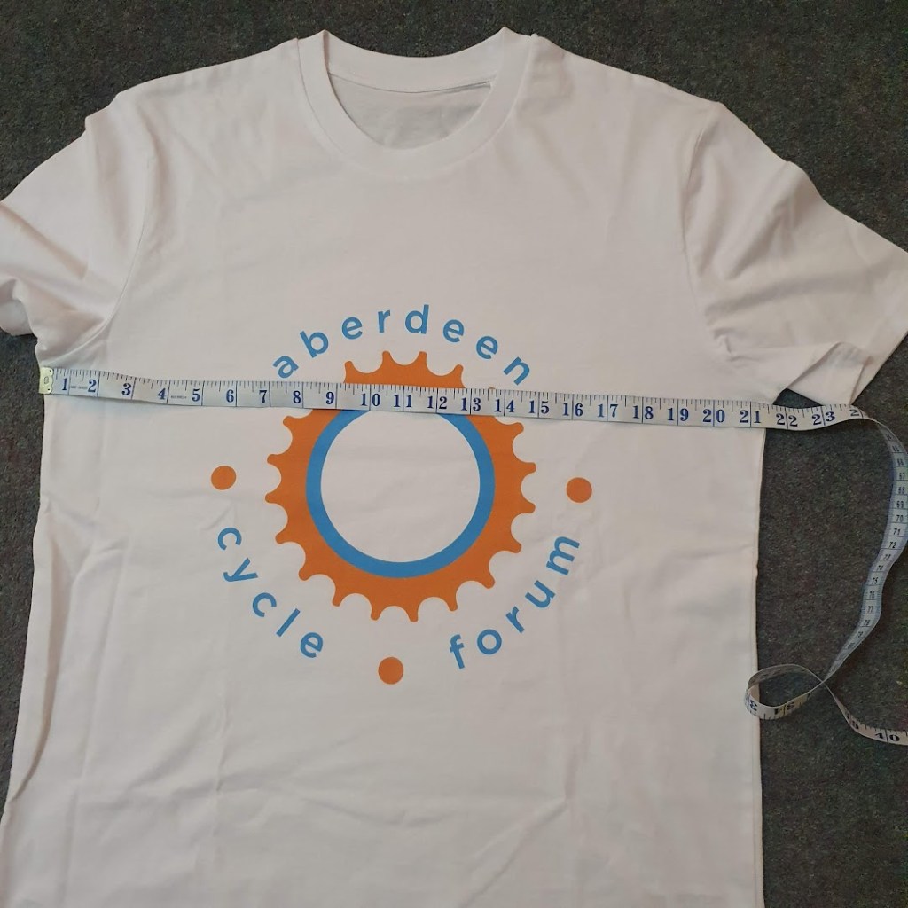 The tshirt with measuring tape showing about 21.5inches from armpit to armpit