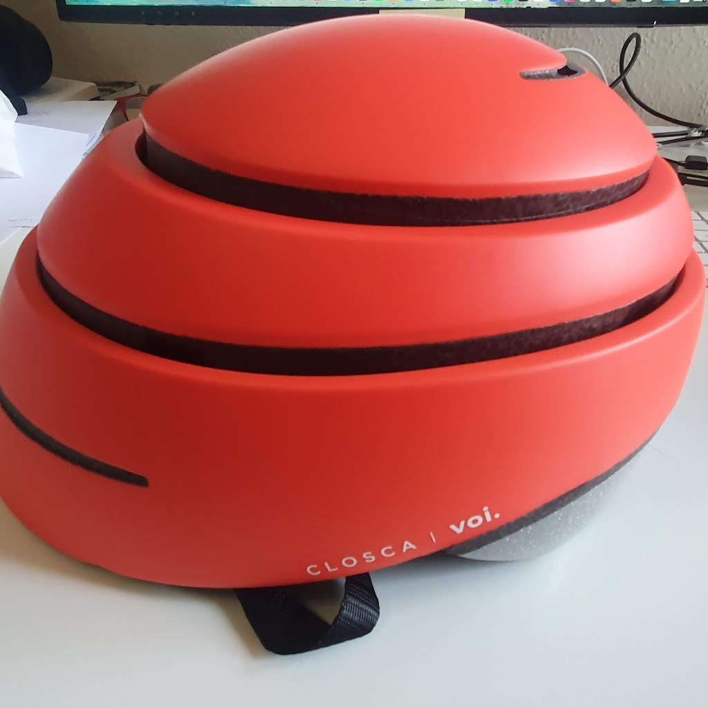 An orange collapsible helmet